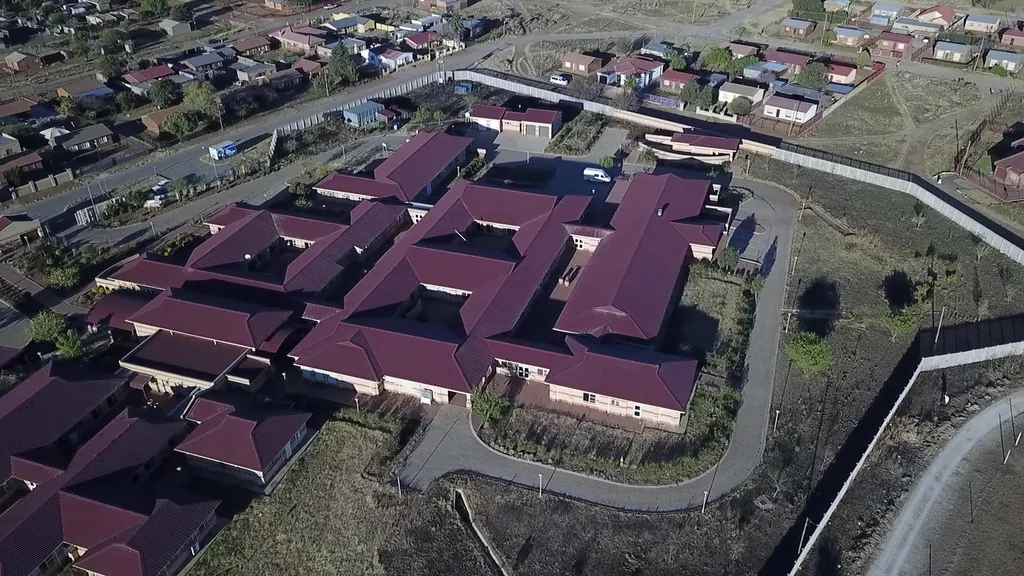 Aerial view of Itsoseng Community Health Centre, a group of red-roofed buildings